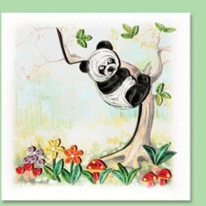 Quilled panda on tree with flowers