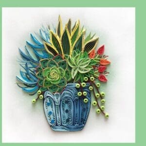 Intricate quilled succulent arrangement in pot