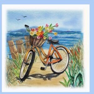 Artistic quilled bicycle on beach path