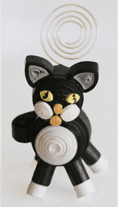 Spiral-tailed paper cat sculpture