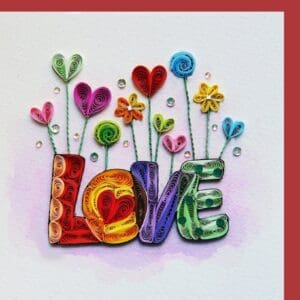 Floral quilling artwork spelling love