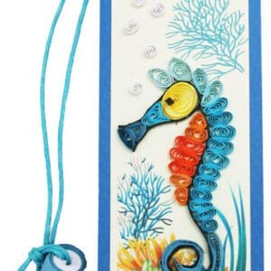 Artistic quilled seahorse with coral background