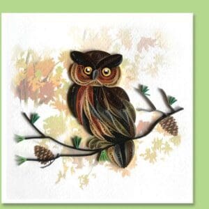 Quilled owl perched on branch