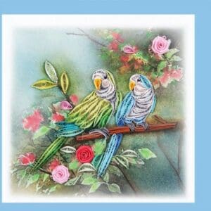 Two quilled birds surrounded by flowers